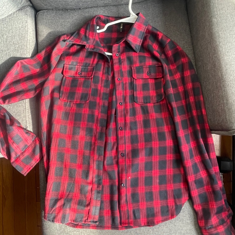 Plaid button down shirt. Never worn.